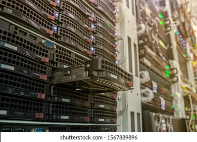 DNS And Cloud Storage Services Are In The Racks. The Stick Out Slot For The Hard Drive Is Close Up In The Server Room. Powerful Computer Equipment Of The Internet Provider Is In The Data Center.