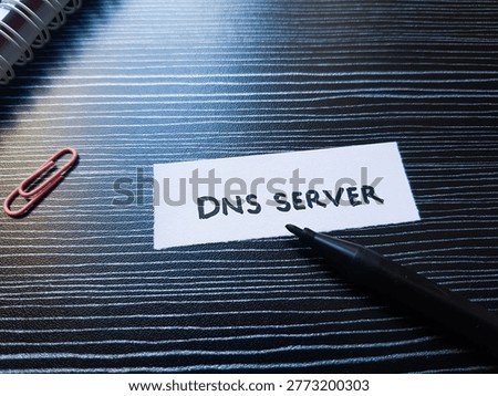 Dns server writting on table background. 