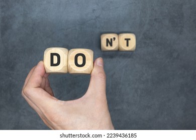 Do or dont. The cubes form the words Doit or dont. Concept of business and Challenge, vision, opportunity, decision, motivation, choice, doubt.