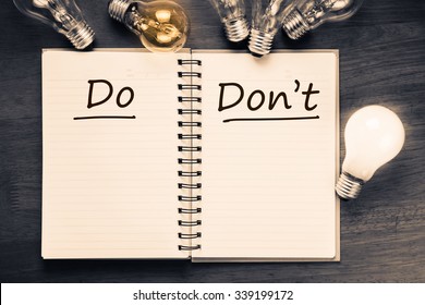 Do and Don't sorting table on notebook with light bulbs