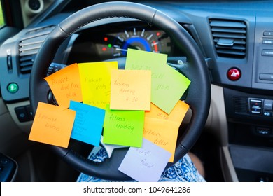 To Do List In A Car On Driving Wheel - Busy Day Concept
