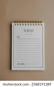 To do list notebook, a helpful planning tool with title and rating sections, spiral bound, and ready for scheduling on a neutral background.