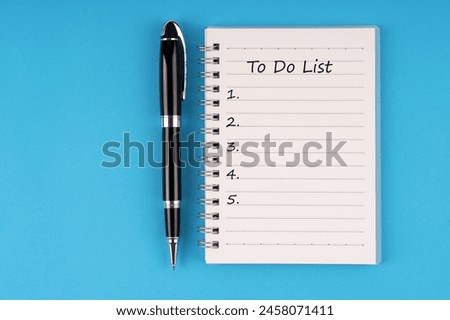 To do list text on notepad on blue background