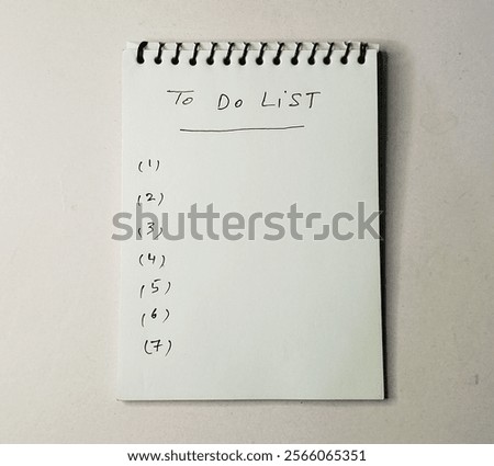 To do list work sheet on white background- hand written numbers 1 to 7 on writing pad, 
