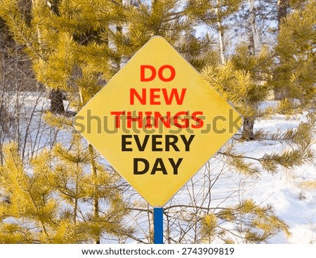 Do new things every day words symbol. Concept words Do new things every day on beautiful yellow road sign. Beautiful winter forest background. Business do new things every day concept. Copy space.