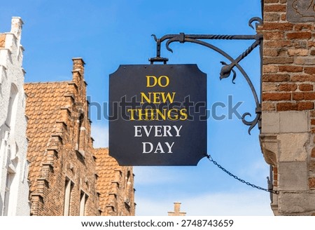 Do new things every day words symbol. Concept words Do new things every day on beautiful black road sign. Beautiful blue sky background. Business do new things every day concept. Copy space.