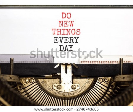 Do new things every day words symbol. Concept words Do new things every day typed on old retro typewriter. Beautiful white background. Business do new things every day concept. Copy space