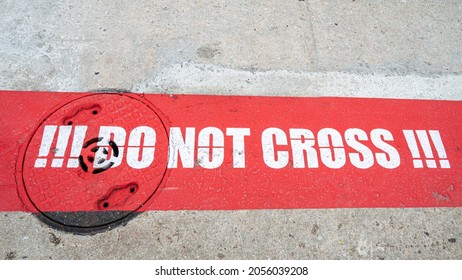 Do Not Cross Red Sign On The Ground