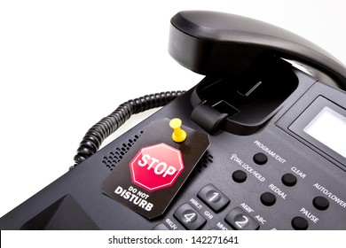 Do Not Disturb Label With A Thumbtack And Office Phone With A Phone Tube. Do Not Disturb With Your Calls Concept. Isolated On White.