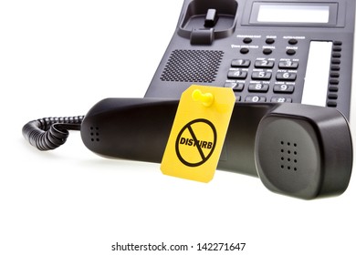 Do Not Disturb Label With A Thumbtack And Office Phone With A Phone Tube. Do Not Disturb With Your Calls Concept. Isolated On White.