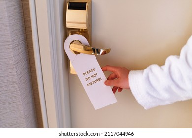 Do Not Disturb Sign On The Doorknob Of Hotel