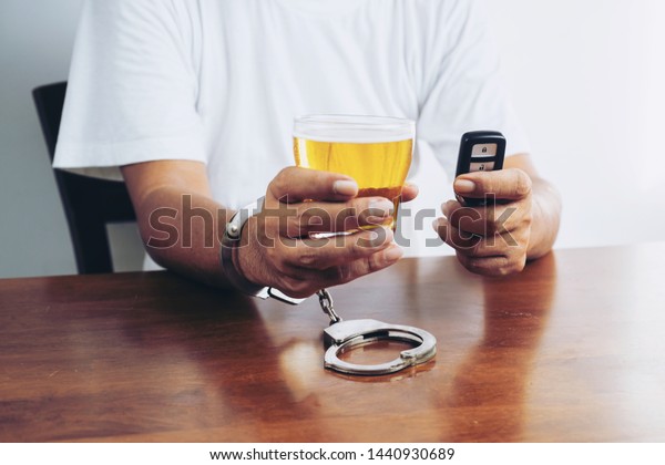Do not drink and\
drive concept. Cropped image of man showing stop gesture and\
refusing to drink beer. a
