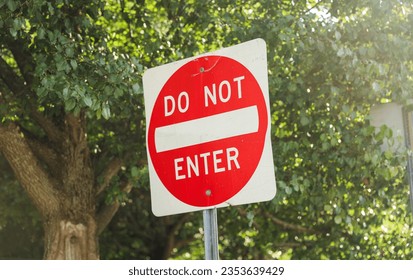 Do Not Enter sign signifies restricted access, a barrier against unwanted paths, emphasizing safety, control, and prohibition in its symbolic message - Shutterstock ID 2353639429