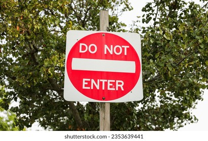 Do Not Enter sign signifies restricted access, a barrier against unwanted paths, emphasizing safety, control, and prohibition in its symbolic message - Shutterstock ID 2353639441