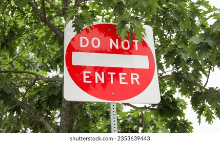 Do Not Enter sign signifies restricted access, a barrier against unwanted paths, emphasizing safety, control, and prohibition in its symbolic message - Shutterstock ID 2353639443