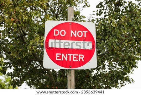 Do Not Enter sign signifies restricted access, a barrier against unwanted paths, emphasizing safety, control, and prohibition in its symbolic message