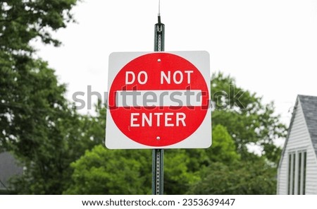 Do Not Enter sign signifies restricted access, a barrier against unwanted paths, emphasizing safety, control, and prohibition in its symbolic message