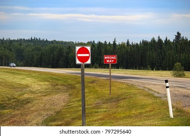 A Do Not Enter and Wrong Way sign on a highway