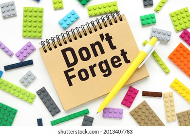 Do Not Forget. text on a craft notebook near the constructor of different colors