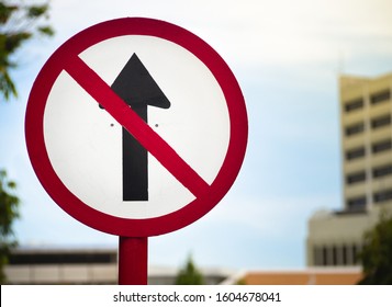 Do Not Go Straight Traffic Sign, Close Up Of Black Arrow In Red Circle Sign For Don't Drive Pass.