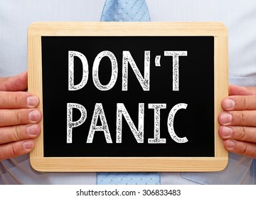 Do not panic - Businessman with chalkboard and text