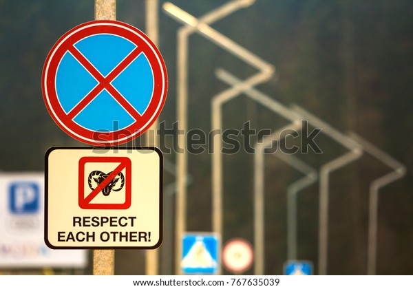 Do not
park road sign with words respect each
other