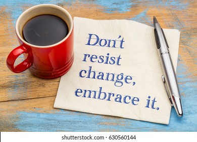 do not resist change, embrace it - motivational phrase on a napkin with a cup of coffee - Powered by Shutterstock