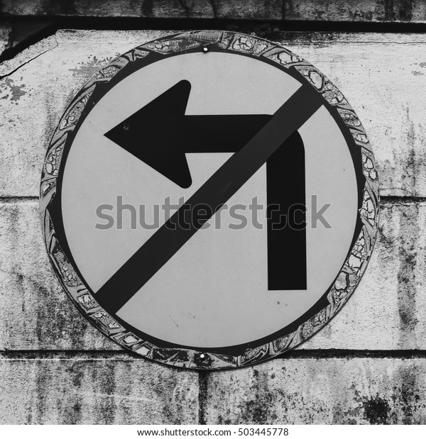 Do not turn\
left traffic sign on black and\
white