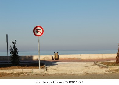 Do Not Turn Right Sign At The End Of A Street Near Beach. High Quality Photo