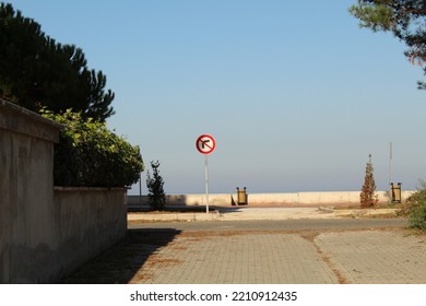 Do Not Turn Right Sign At The End Of A Street Near Beach. High Quality Photo