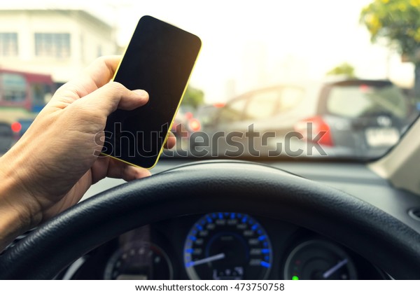 Do not use your phone while driving inside car To\
reduce car accident Concept