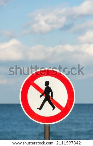 Do not walk sign and sea background.