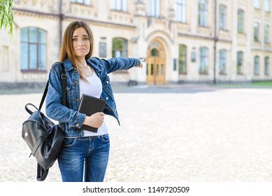 I Do Not Want To Go Back To School! Help! Photo Portrait Of Sad Upset Frustrated Depressed Shy Awkward Horrified Attractive Cute Pretty Girl Showing On Doors To Classroom Blurred Autumn Background