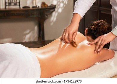 Do the scrapping of traditional Chinese medicine treatment - Shutterstock ID 1734122978