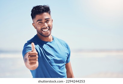 Do something good for yourself and workout. Shot of a man showing thumbs up while out for a run.
