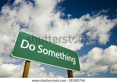 Do Something Road Sign with dramatic clouds and sky.