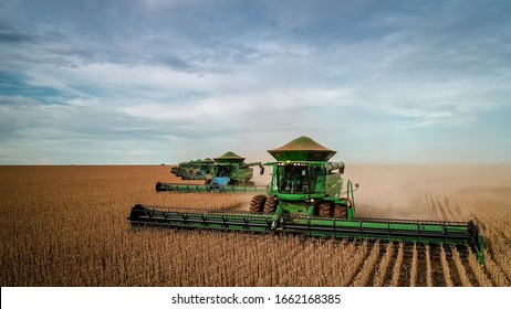 Chapadão do Sul, Mato Grosso do Sul, Brazil, February 27, 2019: Agriculture, positioning of agricultural machinery in the soybean harvest in Brazil, aerial image - Agribusiness