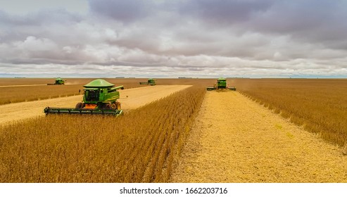Chapadão do Sul, Mato Grosso do Sul, Brazil, February 27, 2020: Agriculture, aerial image, positioning of agricultural machinery during the soybean harvest in Brazil with lateral movement - Agribusine