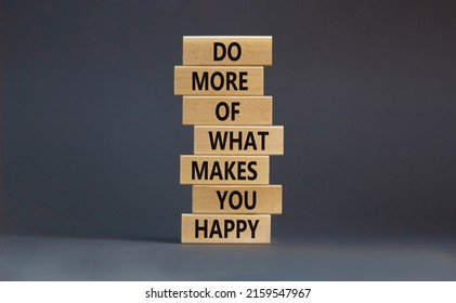 Do what makes you happy symbol. Wooden blocks with words 'Do more of what makes you happy'. Beautiful grey background, copy space. Business, do what makes you happy concept.