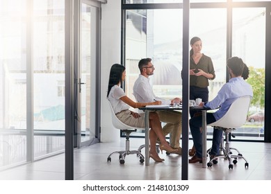 Do you have any suggestions. Full length shot of a group of diverse businesspeople having a meeting in the boardroom.