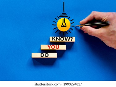 Do You Know Symbol. Businessman Hand. Wooden Blocks With Words 'do You Know'. Beautiful Blue Background. Yellow Light Bulb Icon. Business And Do You Know Concept. Copy Space.