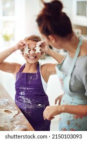 Do You Like My Glasses, The Better To Cook With. Shot Of A Mother And Daughter Preparing Food In The Kitchen At Home.