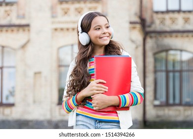 Do You Speak English. Happy Child Listening To English Audio Course. Little Girl Learning English With Audio Book. Improve Your English With Audio Lessons.