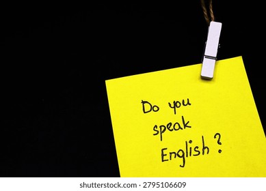 do you speak english? write on yellow card on black background 