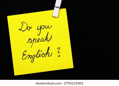 do you speak english? write on yellow card on black background 
