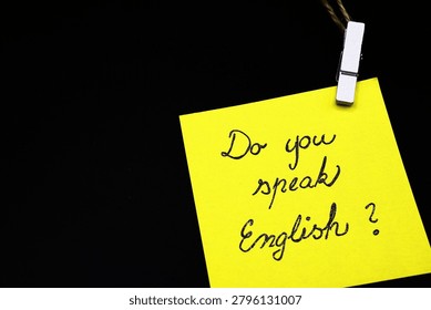 do you speak english? write on yellow card on black background 