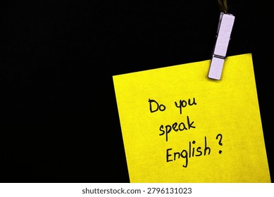 do you speak english? write on yellow card on black background 