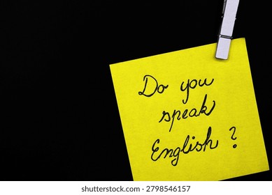 do you speak english? write on yellow card on black background 