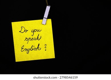 do you speak english? write on yellow card on black background 
