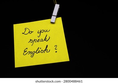 do you speak english? write on yellow card on black background 